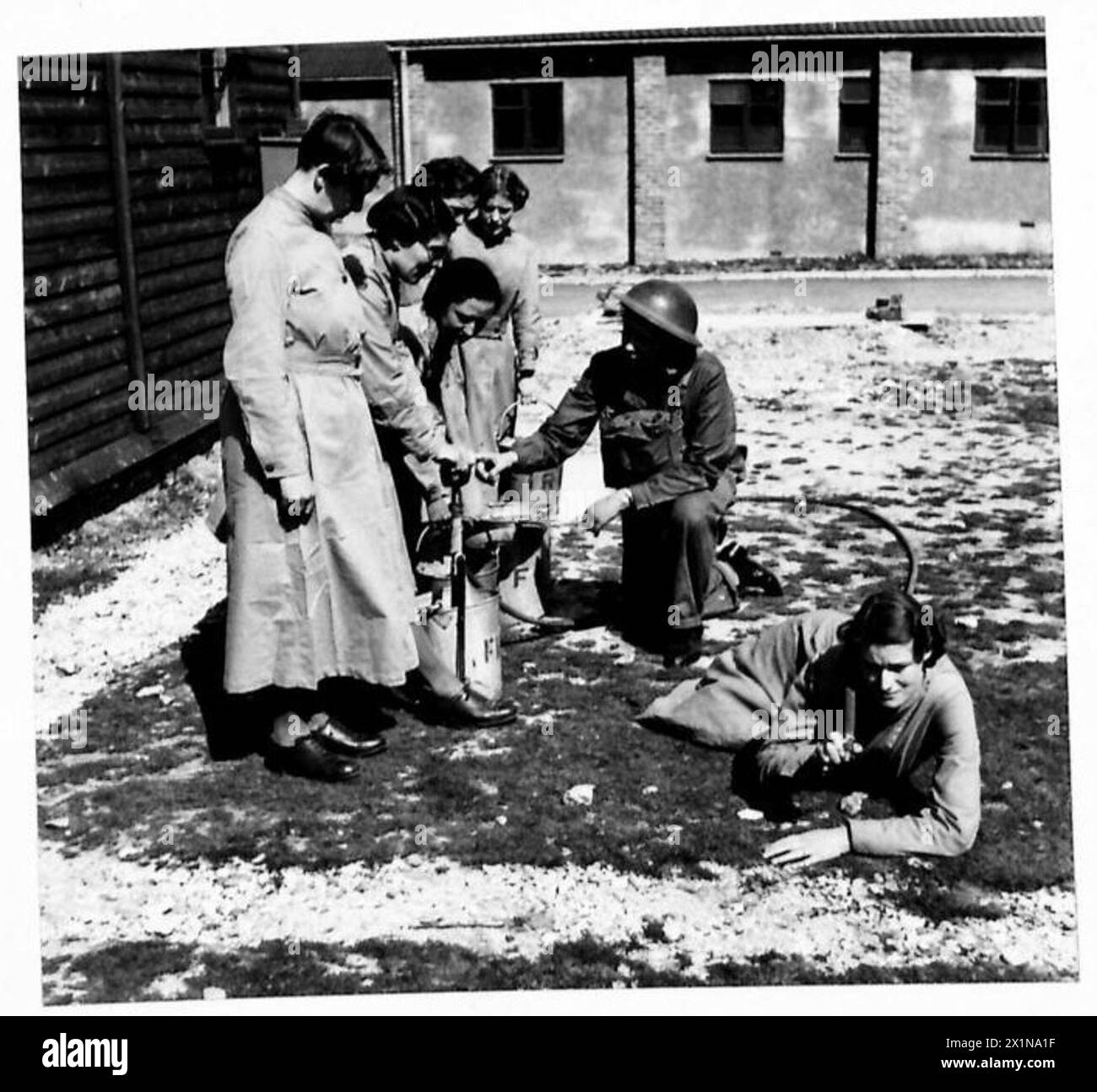 A.T.S. IN TRAINING - A stirrup pump team at drill. The pump members are