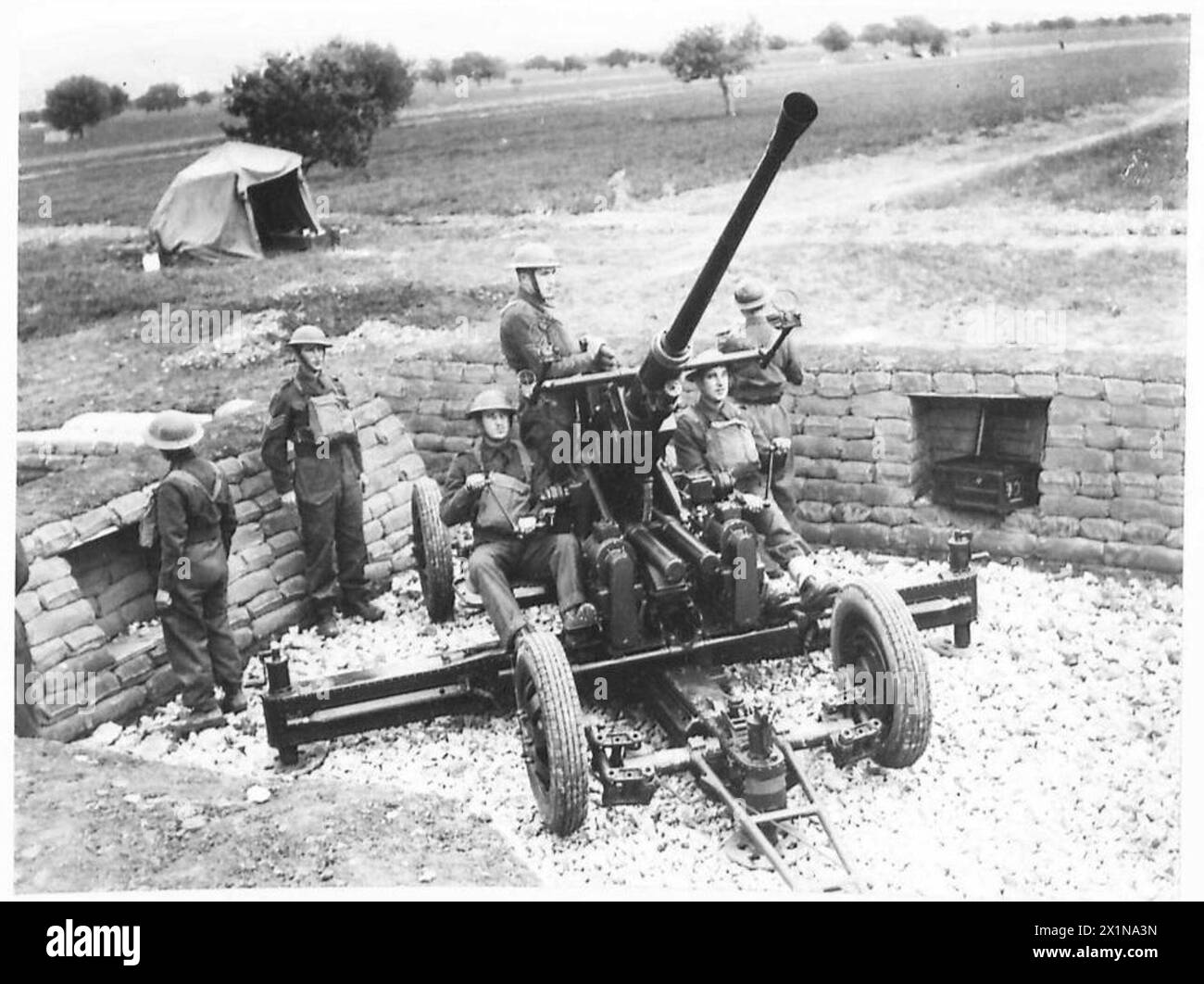 BRITISH A.A. GUNNERS IN GREECE A light antiaircraft gun installed in