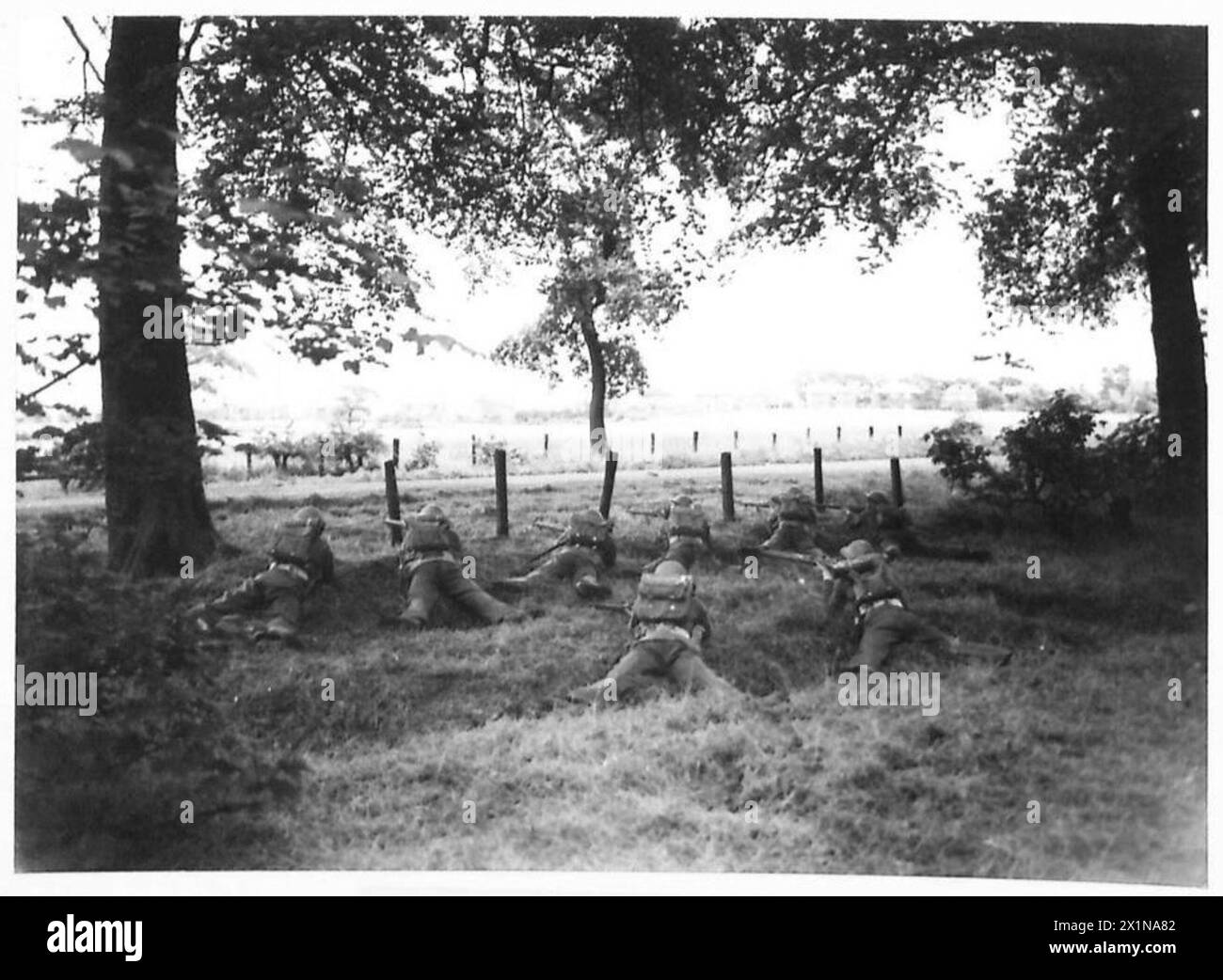 YORK AND LANCASTER REGIMENT IN TRAINING - An outpost takes cover by the ...