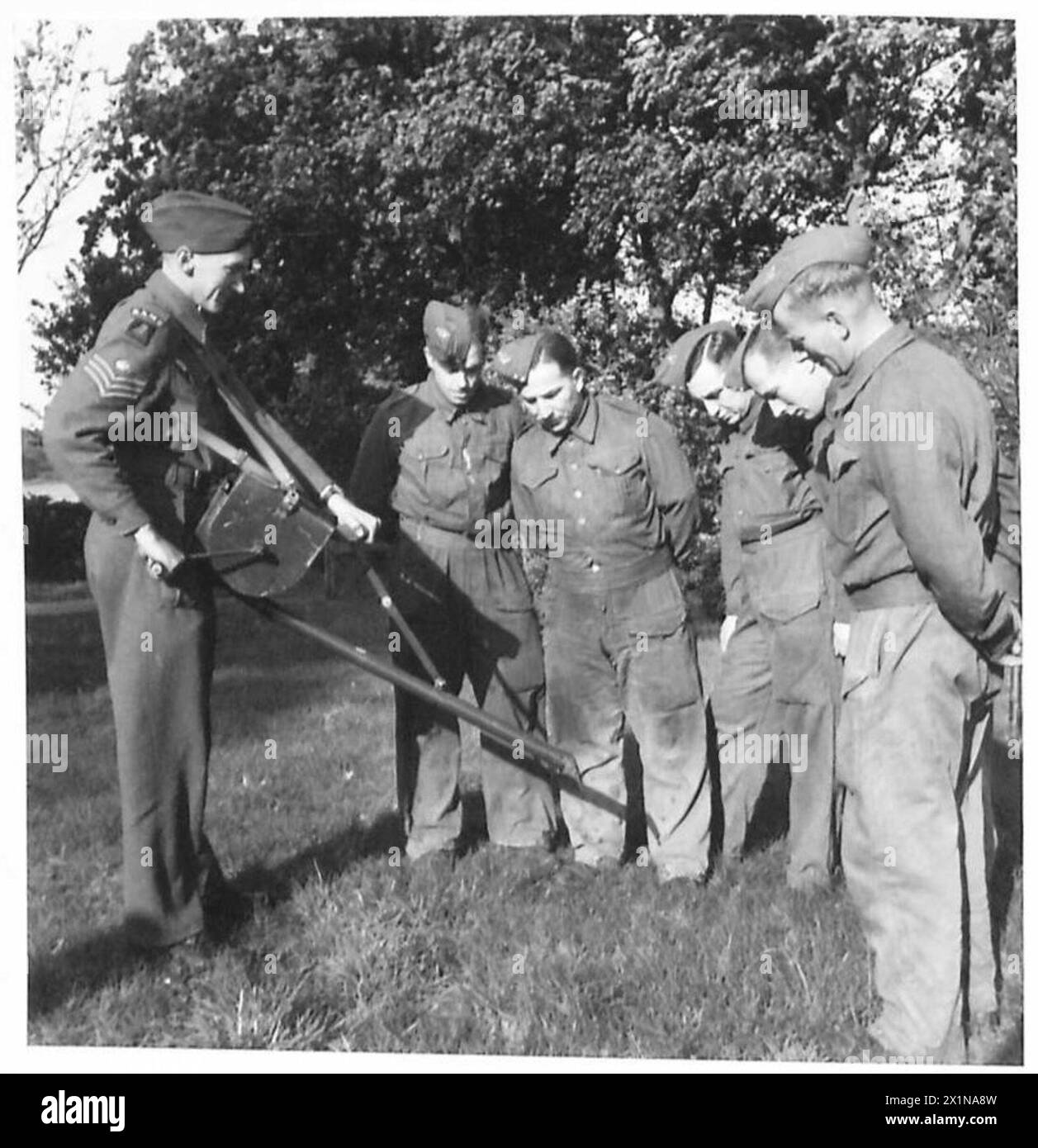 FIGHTING THE MOSQUITO Demonstrating dust gun to class. Dust guns are