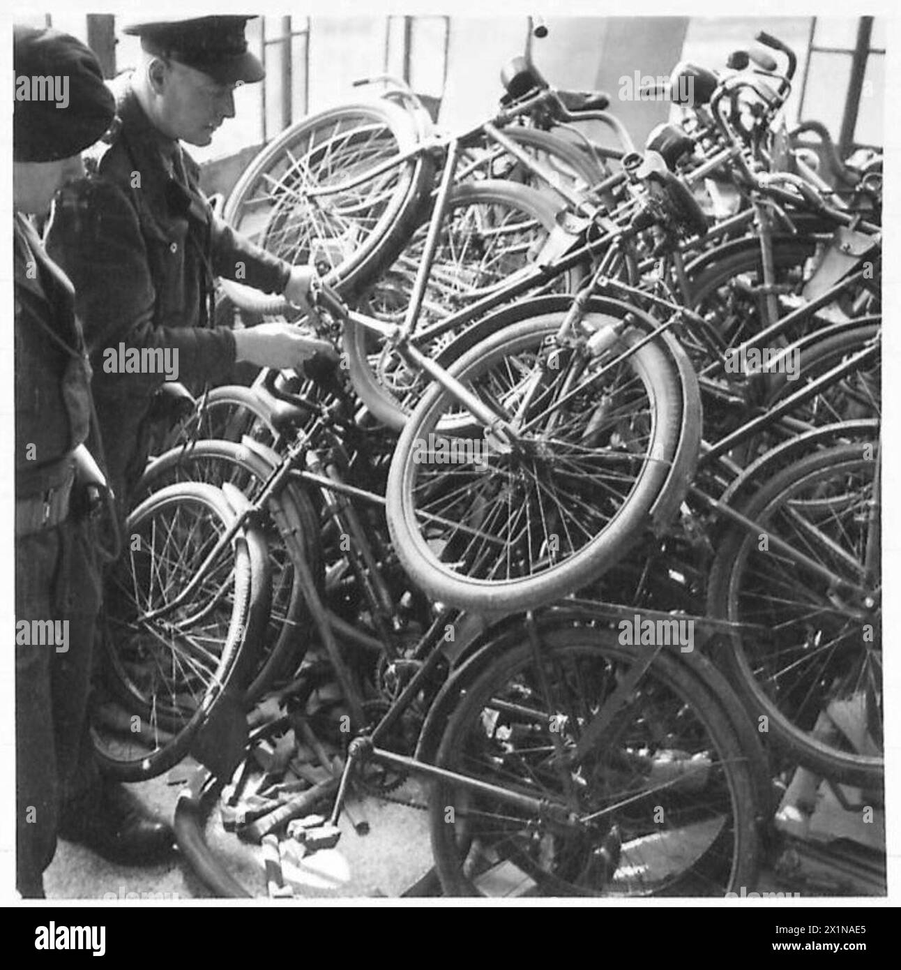 MILITARY GOVERNMENT IN BRUCHHAUSEN-VILSEN AND SYKE - A pile of impounded bicycles at the H.Q. of the Military Government Depot at Syke, British Army, 21st Army Group Stock Photo