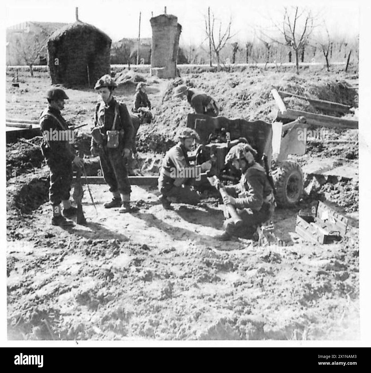 Open Rations British Army A 6-pounder anti-tank gun crew prepares their gun site in the village ...
