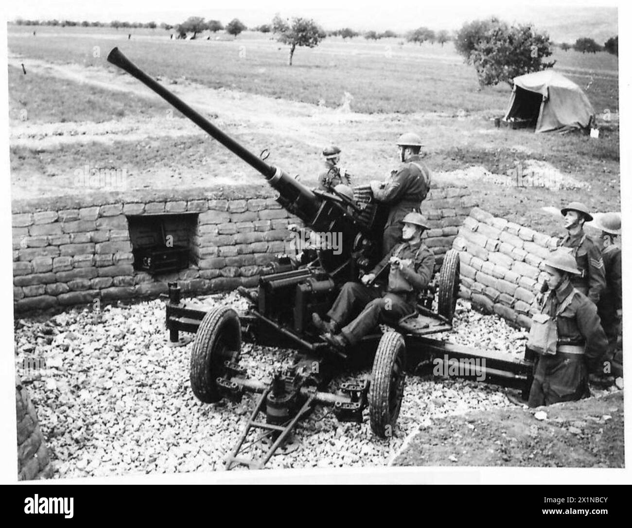 BRITISH A.A. GUNNERS IN GREECE A light antiaircraft gun installed in