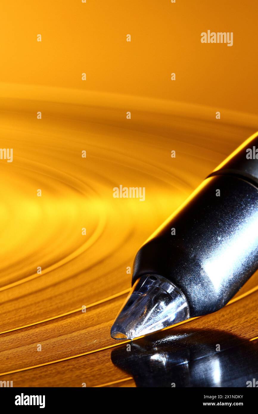 Close up of a HI-FI record player turntable stylus tracking a groove on ...