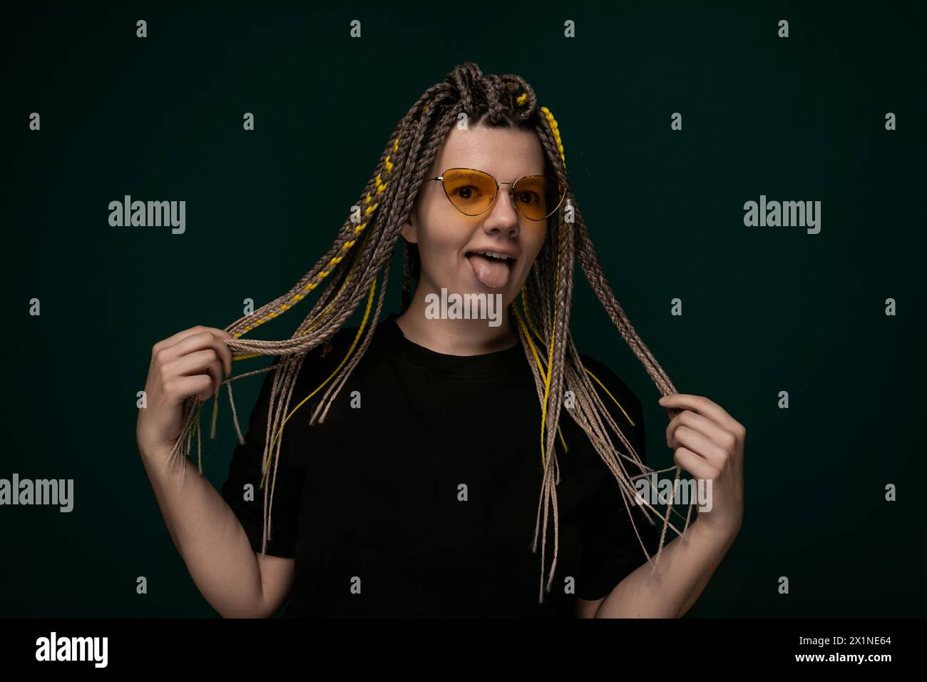 Black woman examining face in hi-res stock photography and images - Alamy