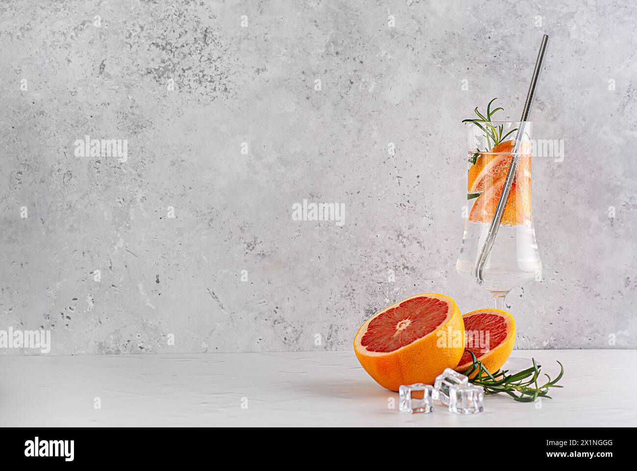 Blank photography of soda with grapefruit, rosemary, cocktail, rum, gin, tonic, fruit; ice, carbonated, drink, refreshment, beverage, liquid; water; Stock Photo