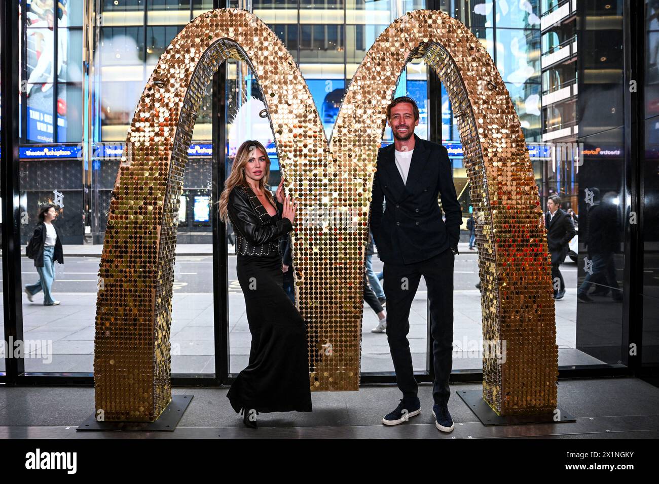 EDITORIAL USE ONLY Abbey Clancy and Peter Crouch at a multi-sensory experience, launched by McDonald's, at London's Outernet to announce their upgraded beef burgers with a new soft brioche-style toasted buns, meltier cheese and juicier beef patties. Picture date: Wednesday April 17, 2024. Stock Photo