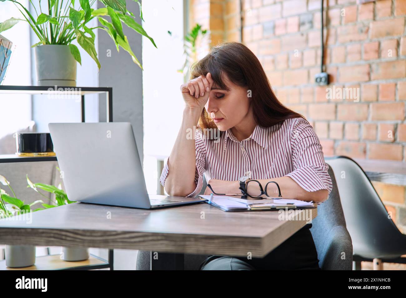 mature-tired-worried-tense-woman-at-workplace-experiencing-stress