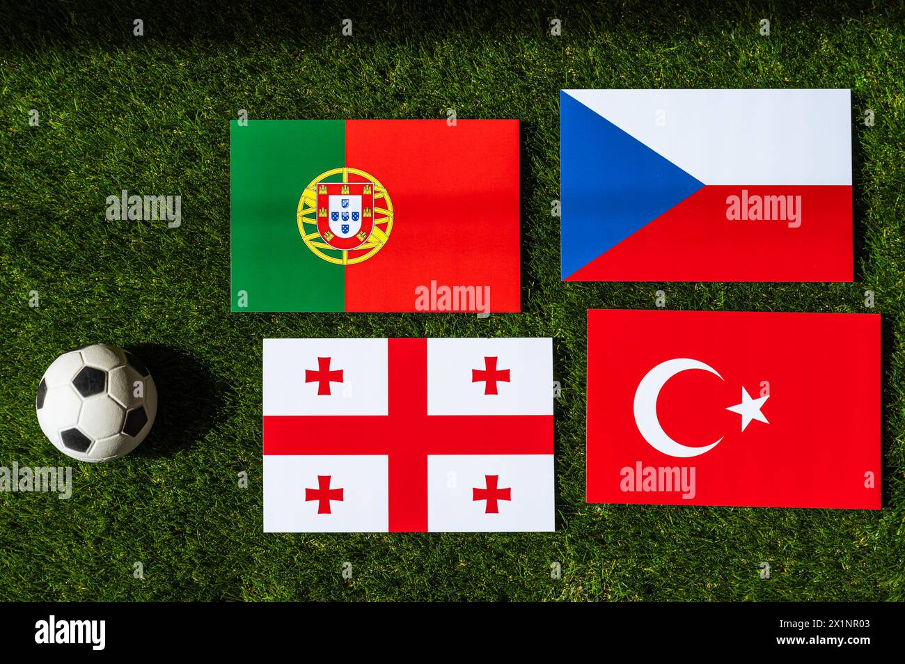 Group F at Europe football tournament in Germany in 2024. Flags of Turkey, Georgia, Portugal, Czech Republic and soccer ball on green grass Stock Photo