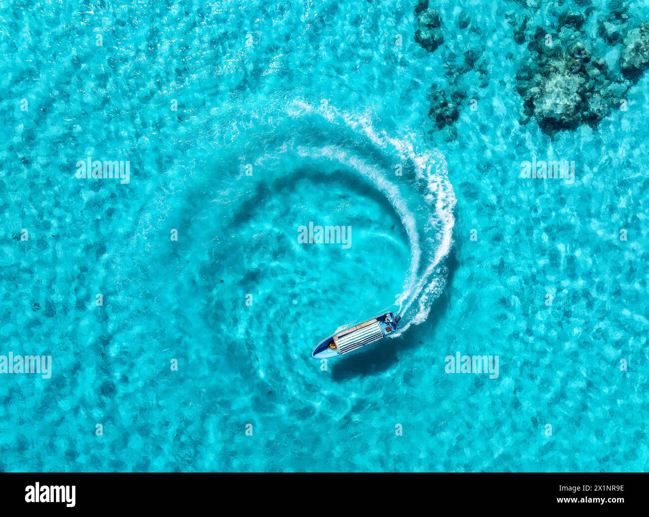 Aerial view of the speed boat in clear blue water on summer sunny day ...