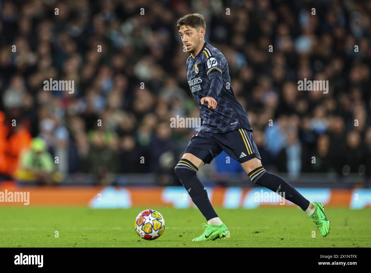 Federico Valverde of Real Madrid looks for a pass during the UEFA Champions League Quarter Final Manchester City vs Real Madrid at Etihad Stadium, Manchester, United Kingdom, 17th April 2024  (Photo by Mark Cosgrove/News Images) Stock Photo