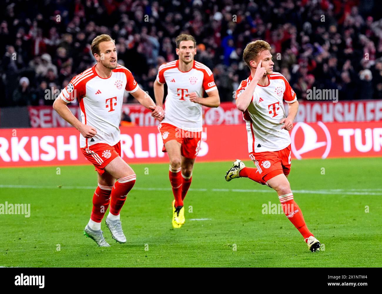 Bayern Munich's Joshua Kimmich (right) celebrates scoring their side's first goal of the game during the UEFA Champions League quarter-final, second leg match at the Allianz Arena, Munich. Picture date: Wednesday April 17, 2024. Stock Photo