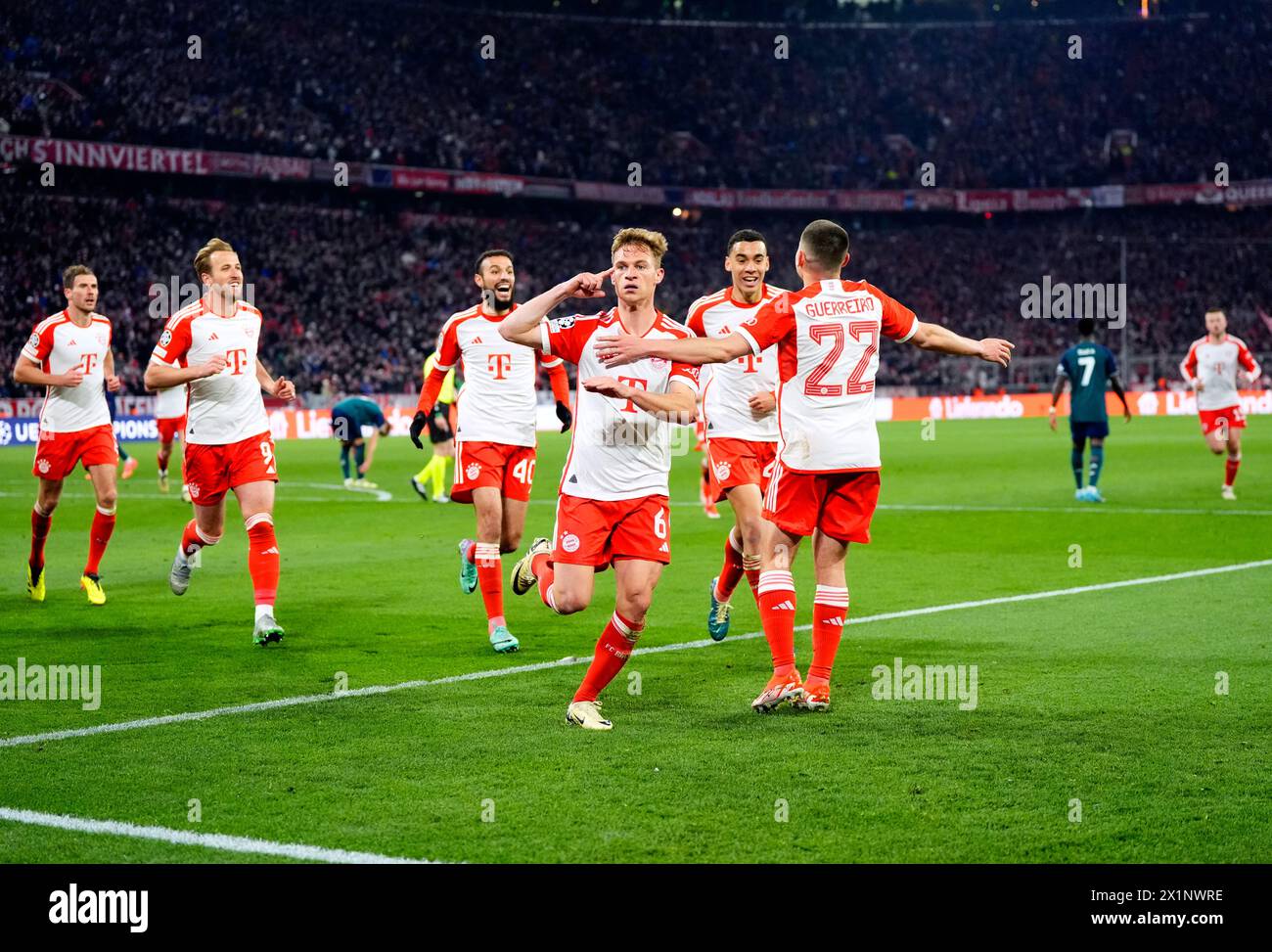 Bayern Munich's Joshua Kimmich (centre) celebrates scoring their side's first goal of the game during the UEFA Champions League quarter-final, second leg match at the Allianz Arena, Munich. Picture date: Wednesday April 17, 2024. Stock Photo