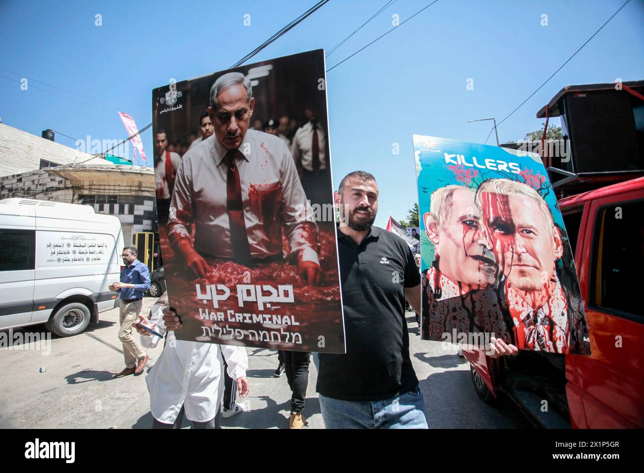 Nablus, Palestine. 17th Apr, 2024. A Palestinian holds a placard with the Israeli Prime Minister Benjamin Netanyahu during a protest against the massacres committed by Israeli forces in Gaza City. Credit: SOPA Images Limited/Alamy Live News Stock Photo