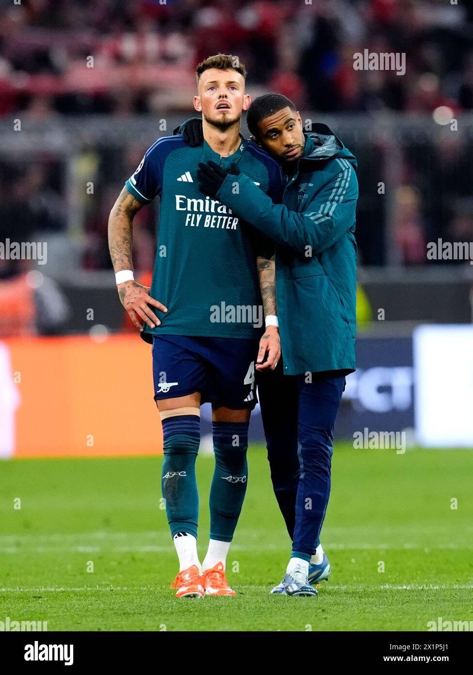 Arsenal's Ben White (left) appears dejected at the end of the UEFA Champions League quarter-final, second leg match at the Allianz Arena, Munich. Picture date: Wednesday April 17, 2024. Stock Photo