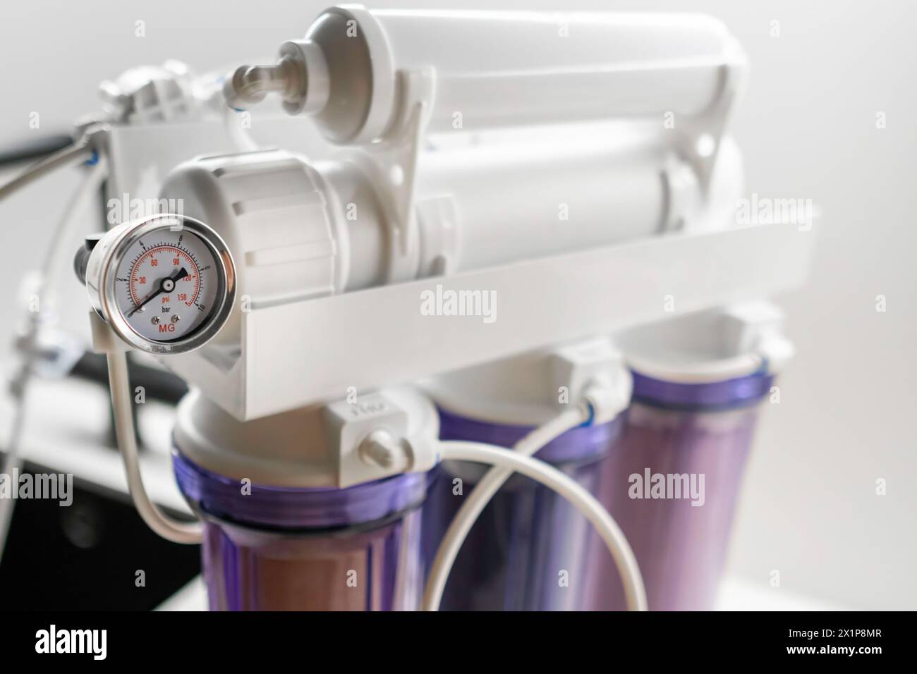 Pressure gauge and mineralizer in a reverse osmosis system for water