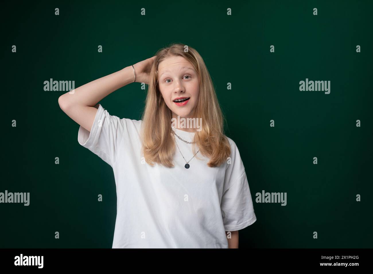 Girl in White Shirt Posing for Picture Stock Photo - Alamy