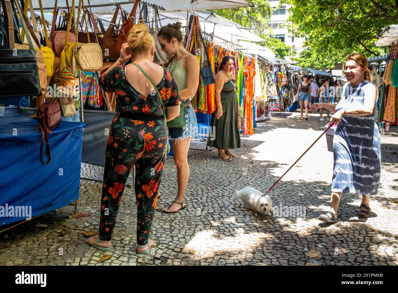 People Choosing/Buying Clothes At The Ipanema Sunday Market (Hippie Fair), Rio de Janeiro, Rio de Janeiro State, Brasil. Stock Photo