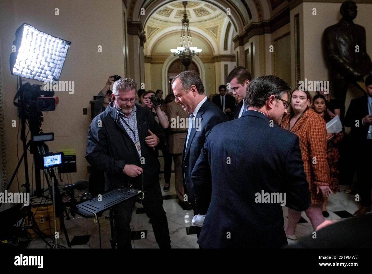 Speaker of the US House of Representatives Mike Johnson (Republican of Louisiana), left, bumps into United States Representative Adam Schiff (Democrat of California) during their television interviews, after the House impeachment of United States Secretary of Homeland Security Alejandro Mayorkas was defeated in the Senate at the US Capitol in Washington, DC, April 17, 2024. Credit: Rod Lamkey/CNP Stock Photo