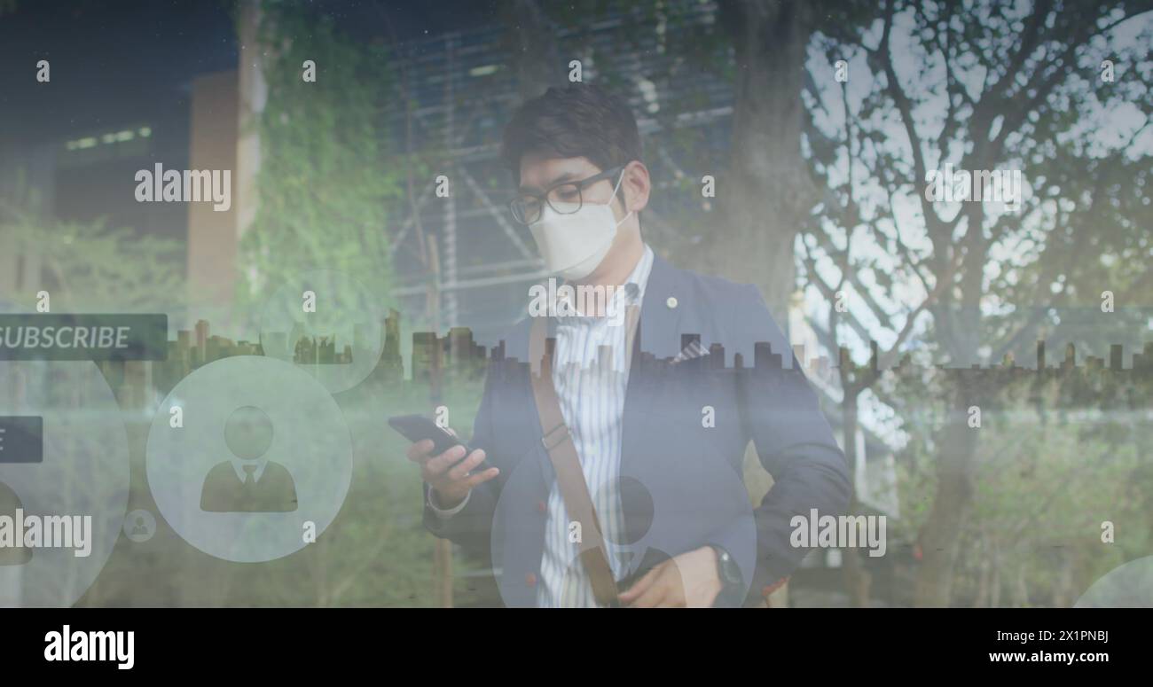Asian male in business attire checking smartphone Stock Photo