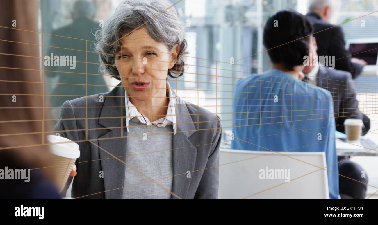 Caucasian middle-aged woman with gray hair talking Stock Photo