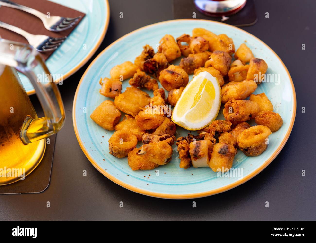 Spanish seafood dish battered fried baby squid Stock Photo Alamy