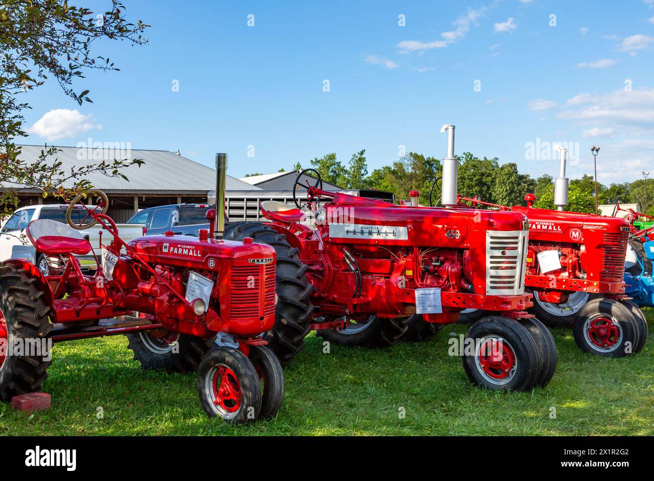 Three antique International Harvester McCormick Farmall tractors on display in a tractor show at the Allen County Fairgrounds in Fort Wayne, Indiana. Stock Photo