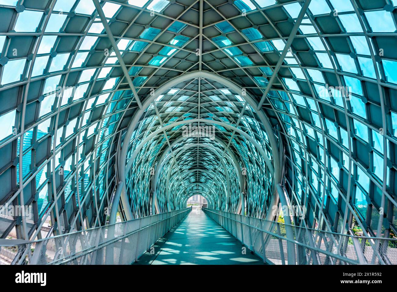 Exquisite pedestrian bridge,opened in 2020,crossing the Klang River,linking Kampung Baru and the City Centre,with views of the city through it's moder Stock Photo