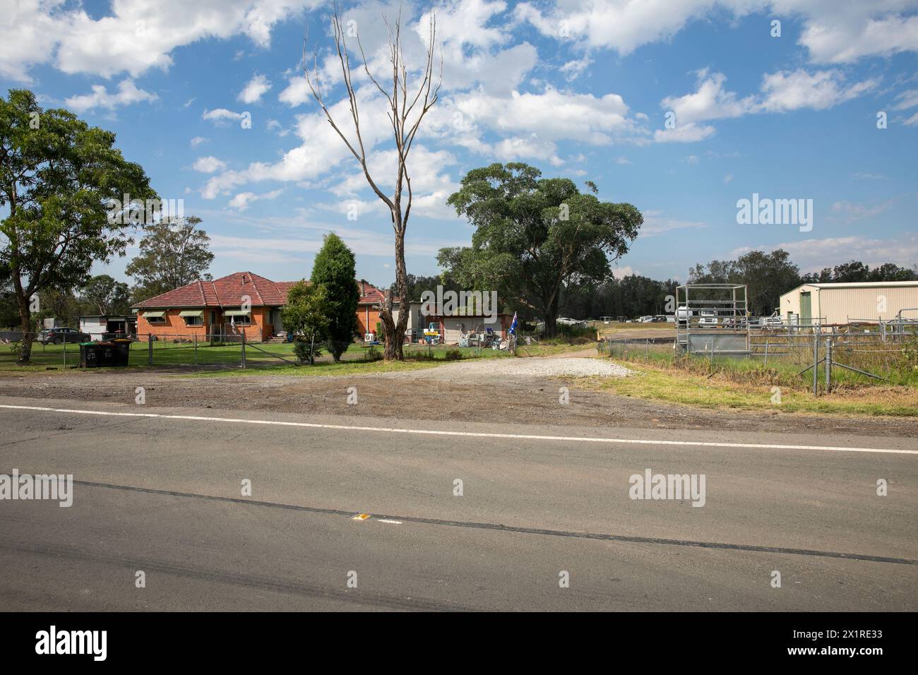 Rural property with acreage on Luddenham road at the corner with Elizabeth Drive, Badgerys Creek, Western Sydney, development is occuring all around Stock Photo