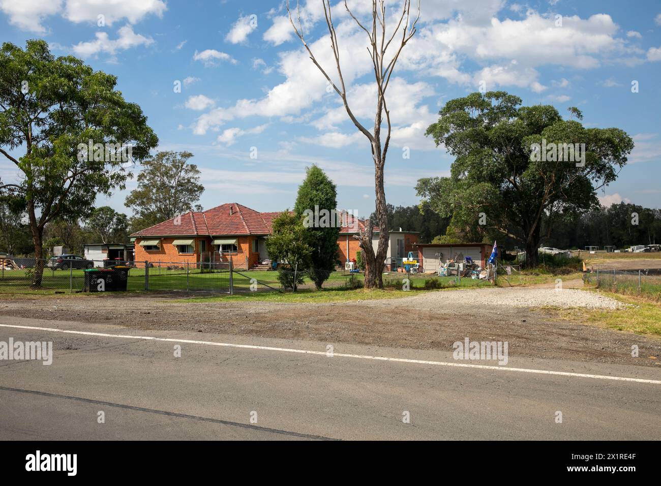 Rural property with acreage on Luddenham road at the corner with Elizabeth Drive, Badgerys Creek, Western Sydney, development is occuring all around Stock Photo