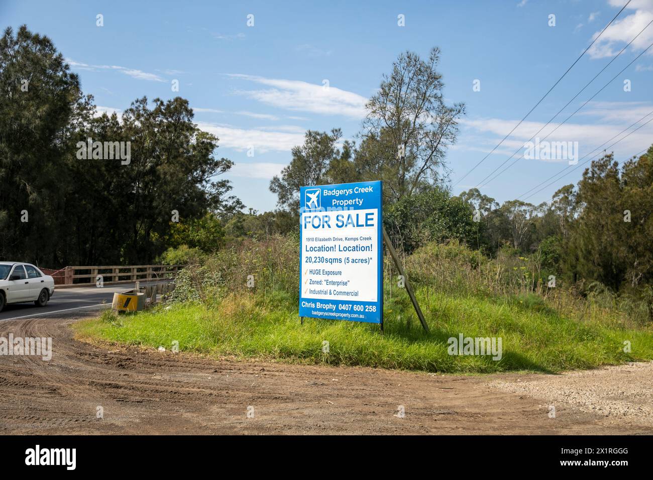 Greater Western Sydney region, Badgerys Creek Property agent advertising 5 acres of land for sale between Badgerys Creek and Luddenham, near airport Stock Photo