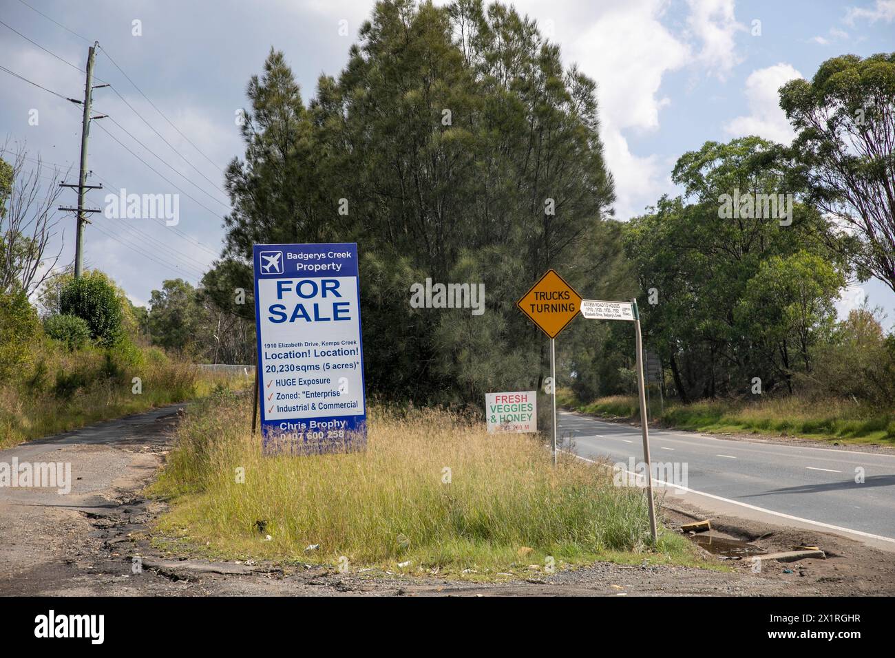 Greater Western Sydney region, Badgerys Creek Property agent advertising 5 acres of land for sale between Badgerys Creek and Luddenham, near airport Stock Photo