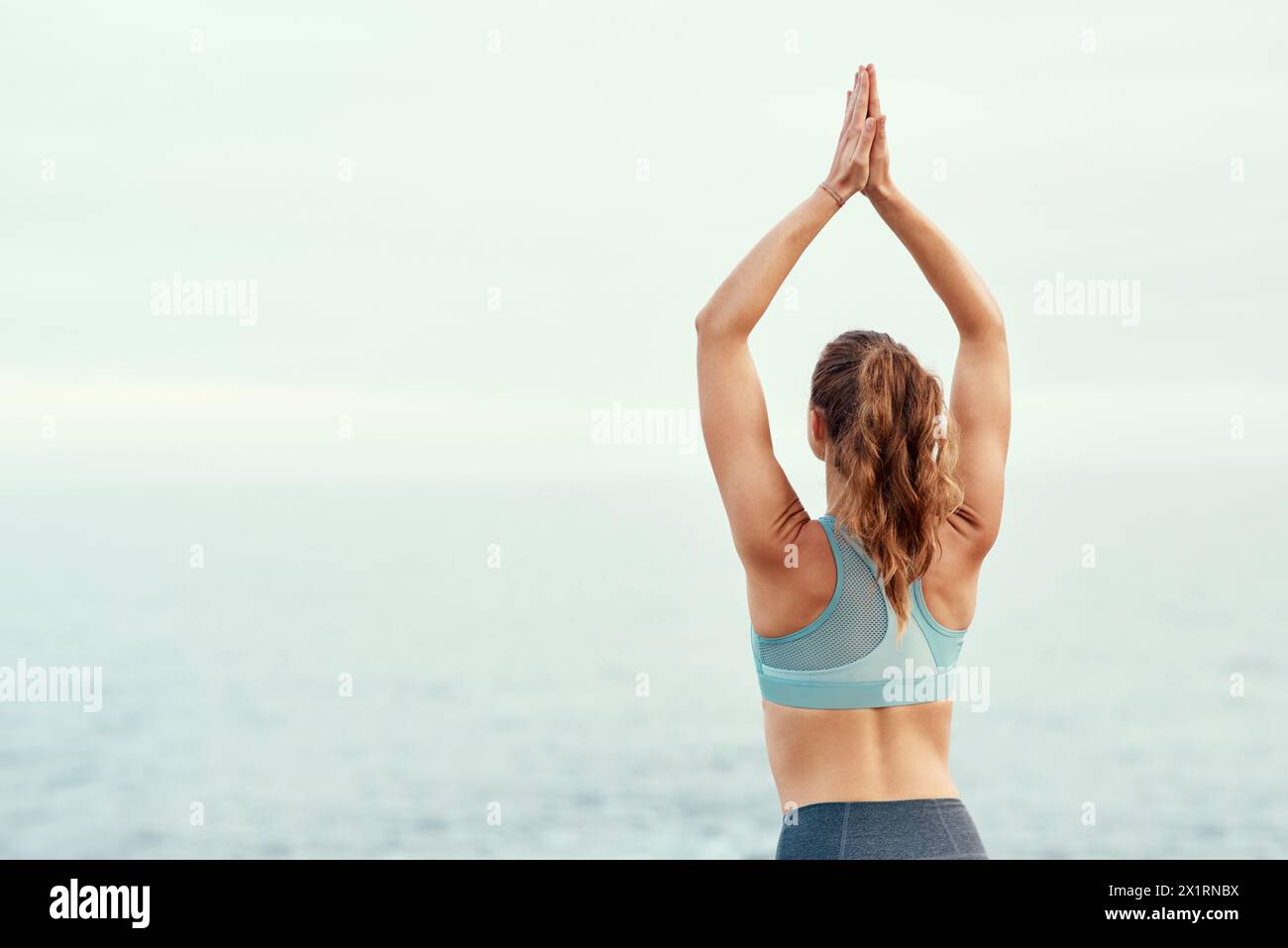Young yogi woman stretching hi-res stock photography and images - Alamy