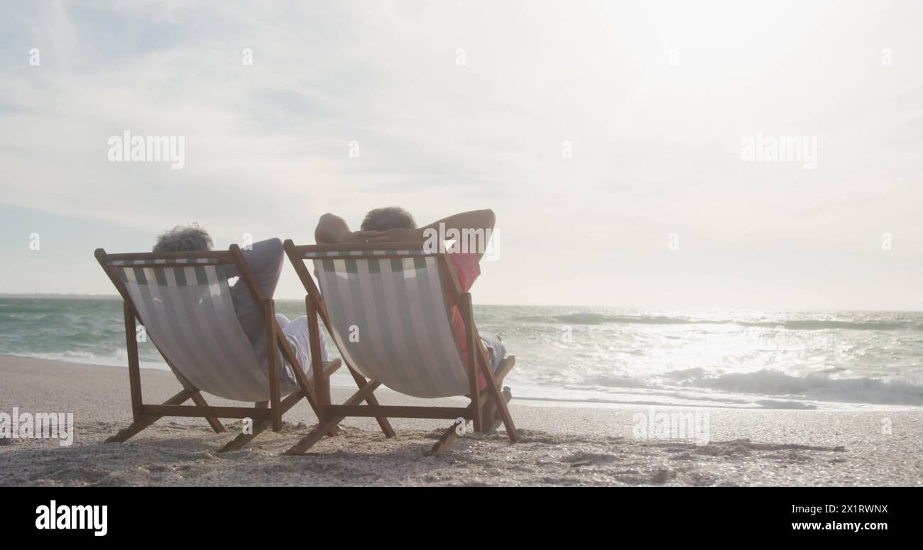 Senior woman on beach chair hi-res stock photography and images - Alamy