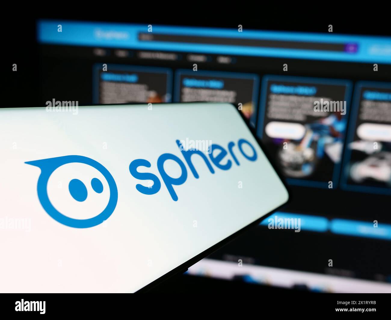 Cellphone with logo of American educational technology company Sphero Inc. in front of business website. Focus on left of phone display. Stock Photo