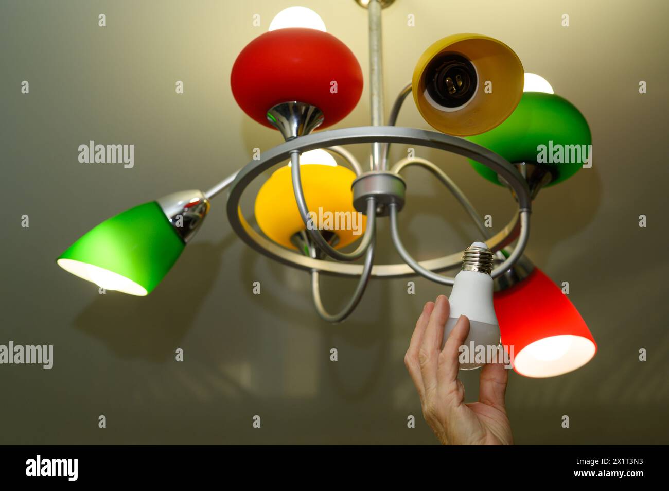 Replacing an energy-efficient LED lamp Stock Photo