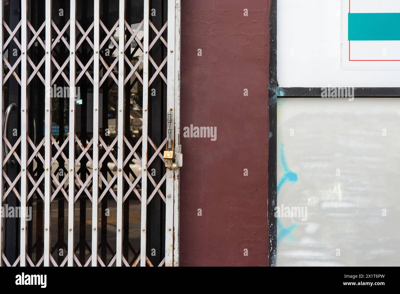 Grunge apartment wall with retractable gate Stock Photo