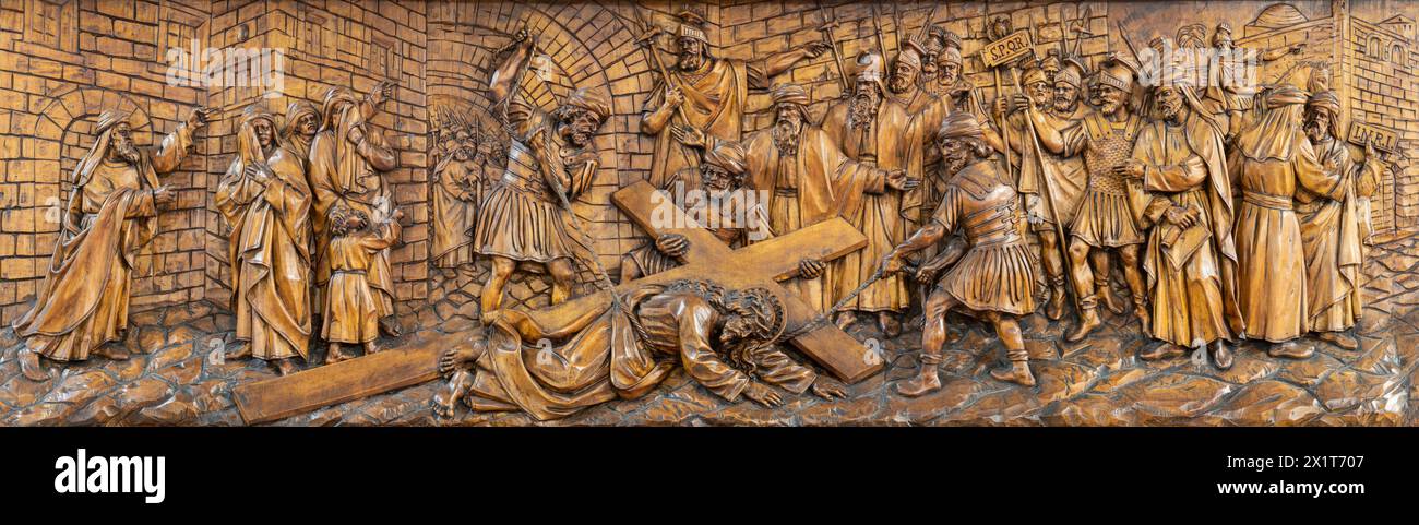 MILAN, ITALY - MARCH 5, 2024: The carved relief  Fall of Jesus under the cross  in the church Chiesa di San Camillo by Annibale Pagnoni (1900). Stock Photo
