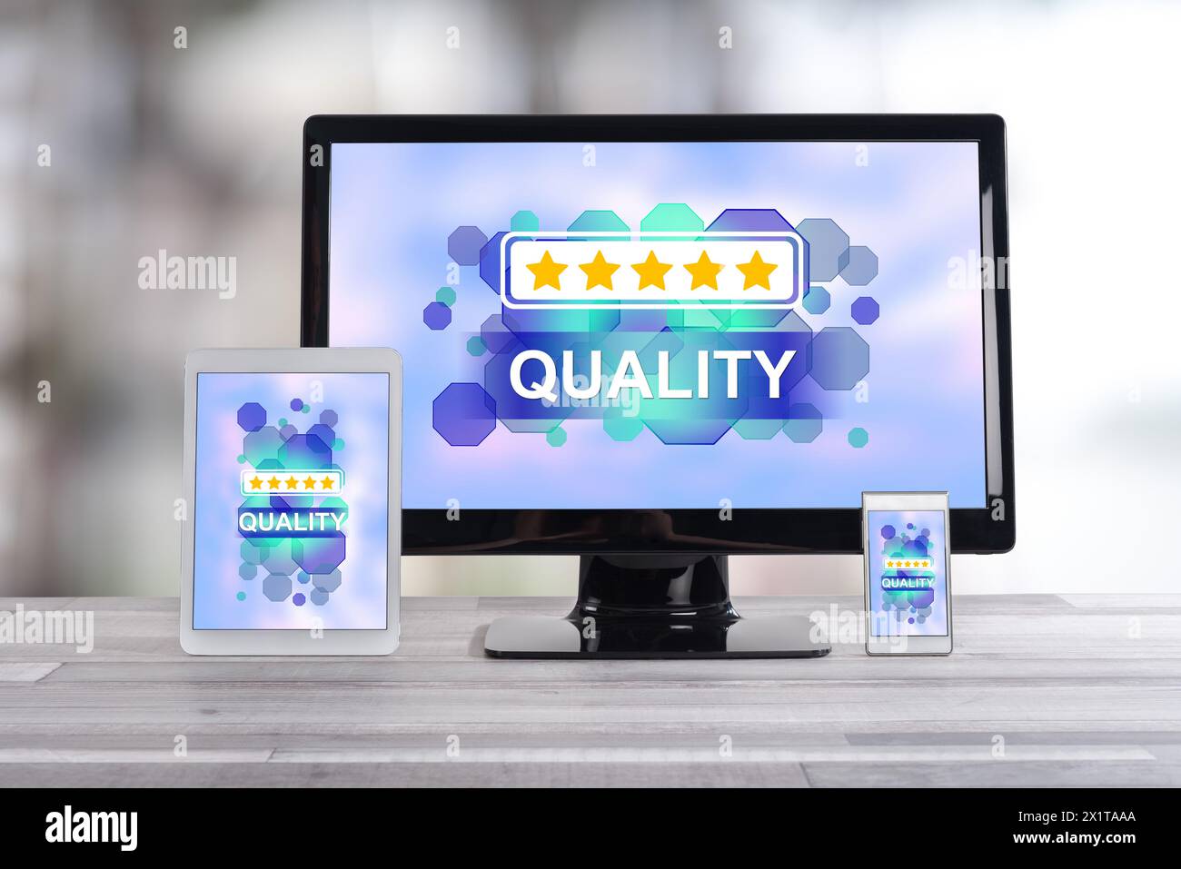Quality concept shown on different information technology devices Stock Photo