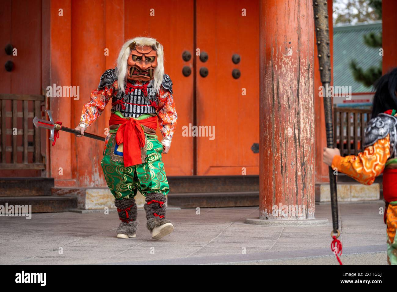 Heian Jingu Shrine Setsubun festival. Performers wearing an oni ( demon or ogre ) costume in the traditional Japanese shinto ritual ceremony. Kyoto. Stock Photo