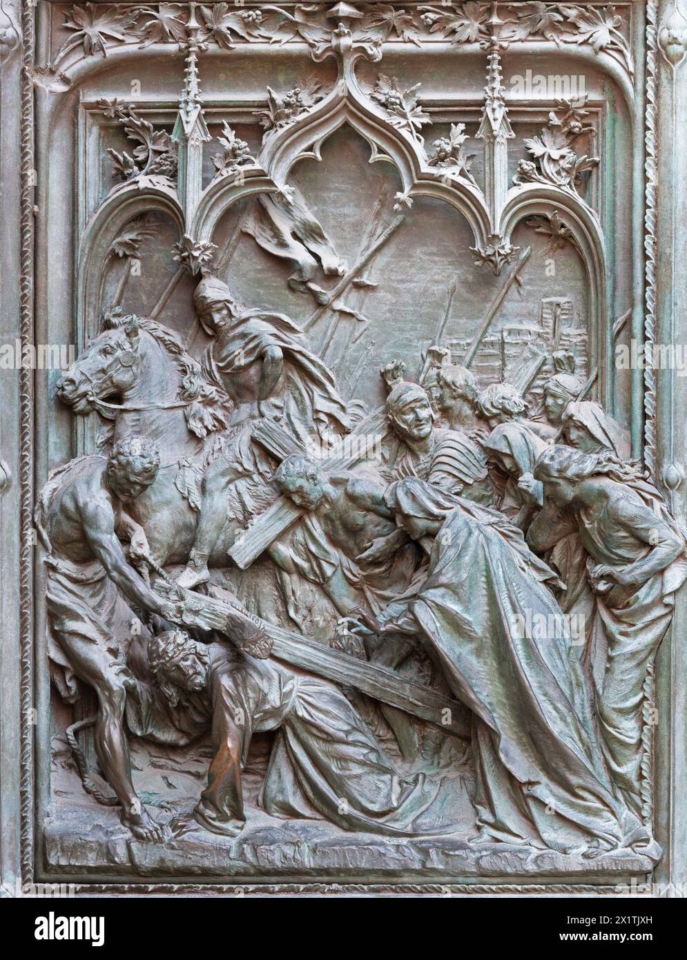 MILAN, ITALY - SEPTEMBER 16, 2024: The detail from main bronze gate of the Cathedral - Fall of Jesus under the Cross -  by Ludovico Pogliaghi (1906). Stock Photo