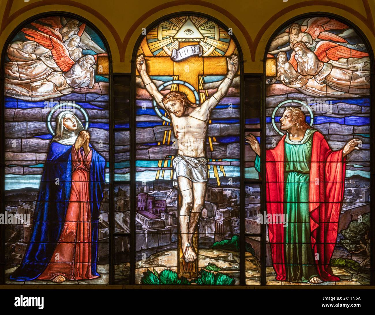 MILAN, ITALY - MARCH 4, 2024: The Calvary in the stained glass in the church Chiesa di San Agostino from year (1950). Stock Photo