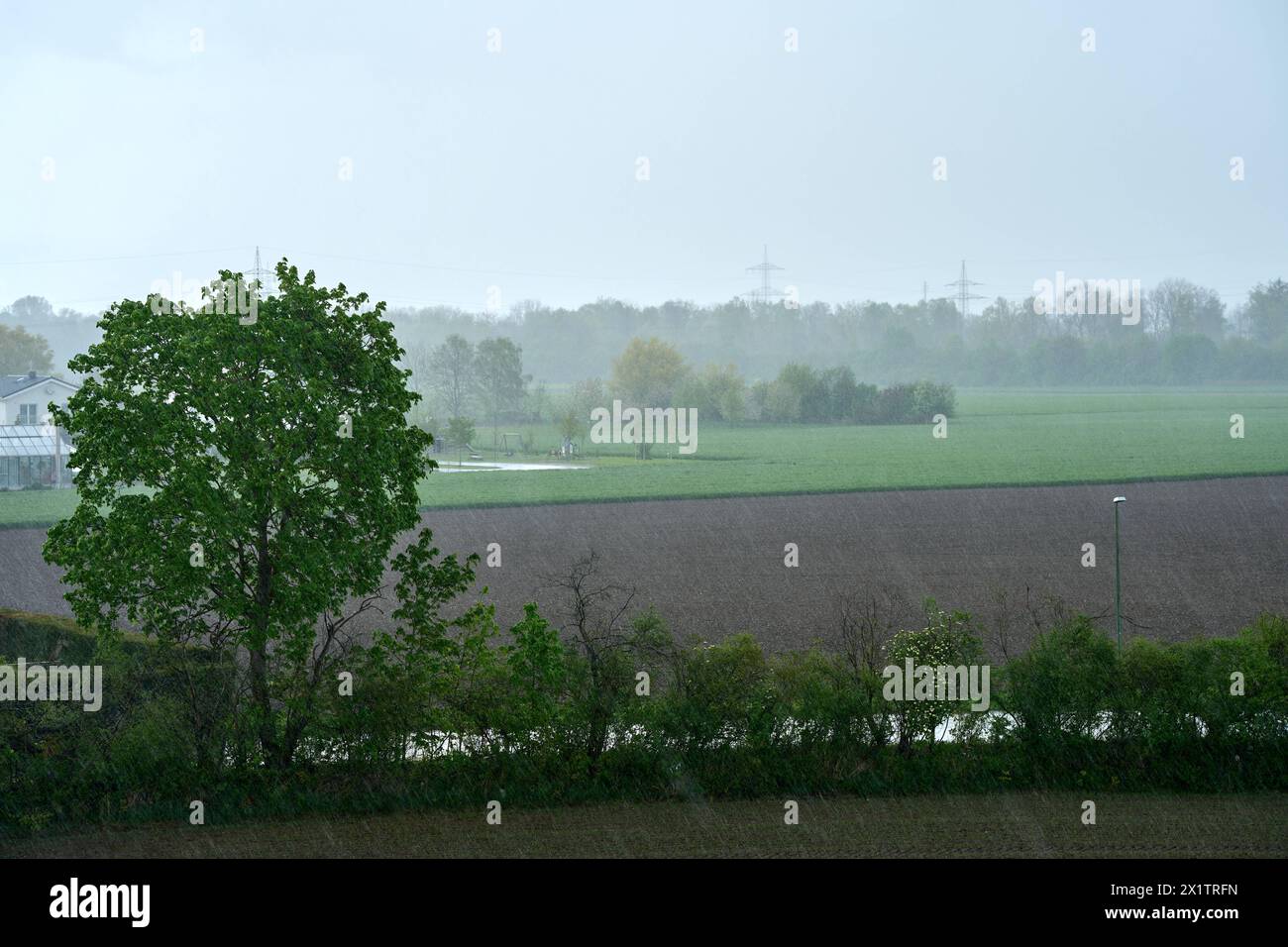 Langweid, Bavaria, Germany - April 15, 2024: Heavy rain in Bavaria. Severe weather *** Starker Regen in Bayern. Unwetter Stock Photo