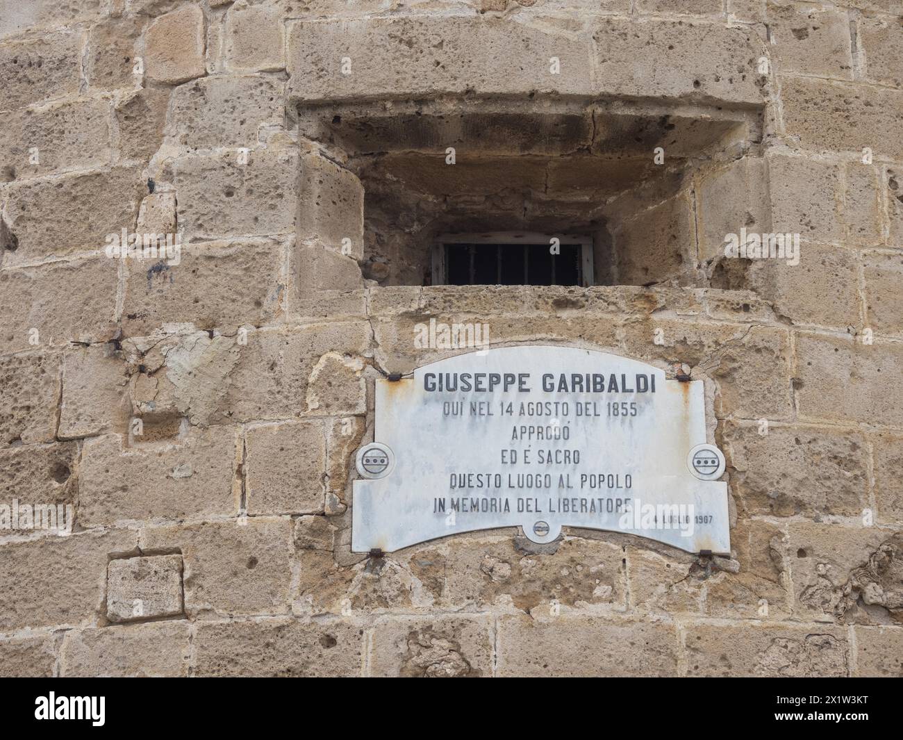 Plaque dedicated to Guiseppe Garibaldi at the Torre di Garibaldi, tower of the fortress, Alghero, Sardinia, Italy Stock Photo