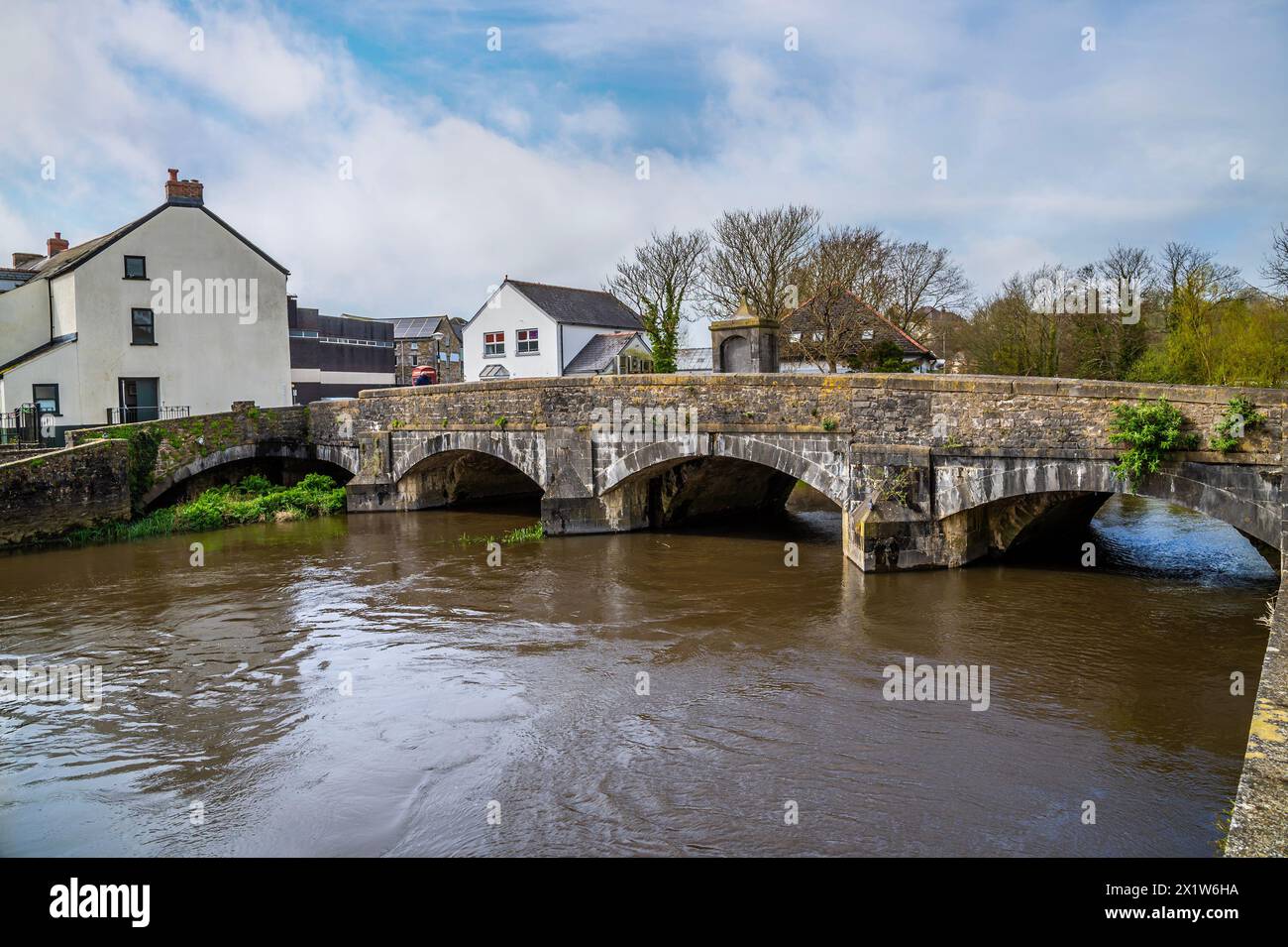 A view along the north bank towards the old bridge on the River Cleddau