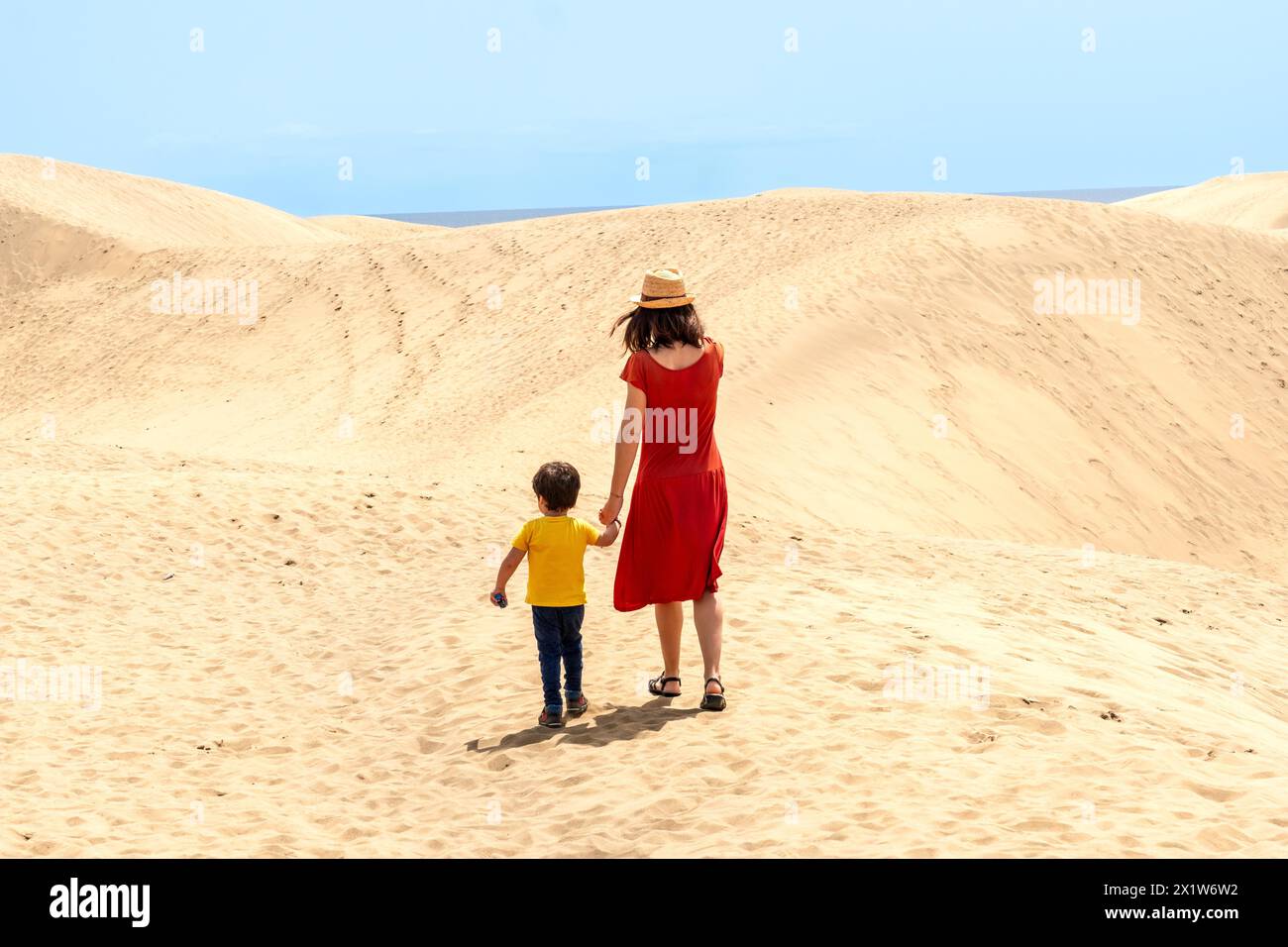 Mother and son tourists exploring the dunes of Maspalomas, Gran Canaria, Canary Islands Stock Photo