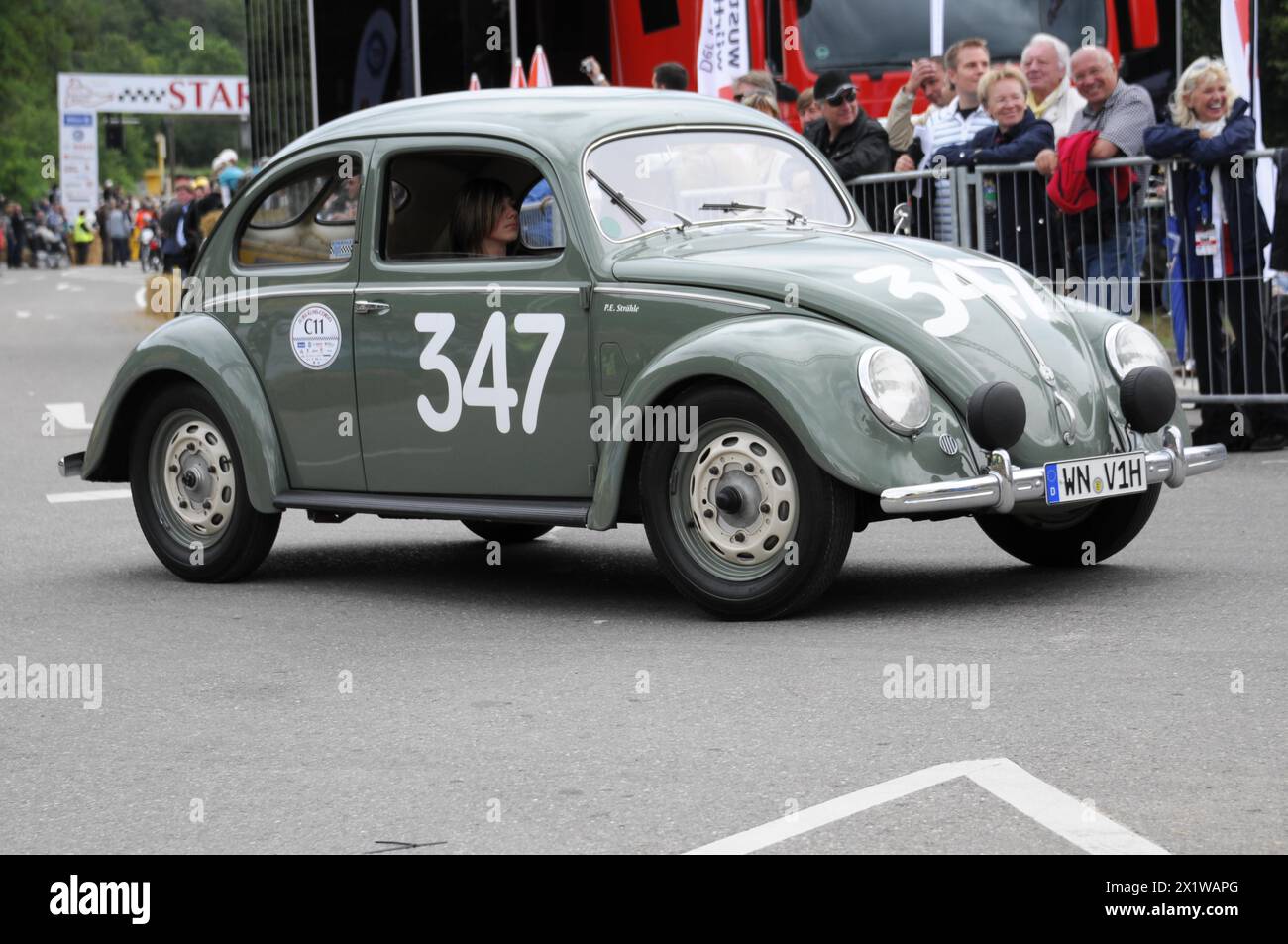 A green Volkswagen Beetle classic car with racing number on the road, SOLITUDE REVIVAL 2011, Stuttgart, Baden-Wuerttemberg, Germany Stock Photo