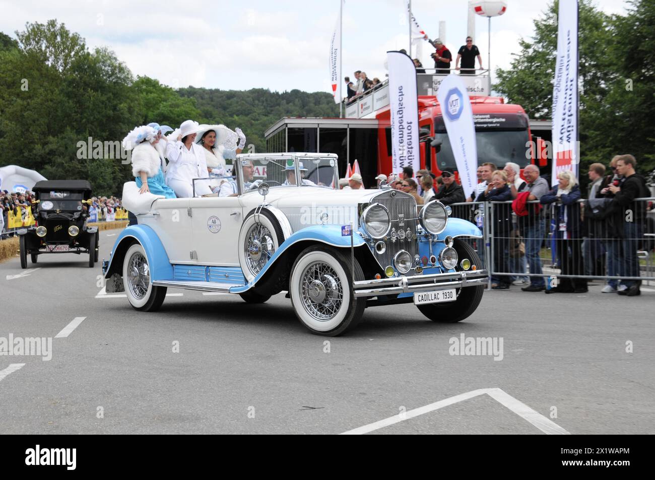 Cadillac Imperial Phaeton, built in 1930, A white and blue convertible vintage car drives past an enthusiastic crowd of spectators, SOLITUDE REVIVAL Stock Photo