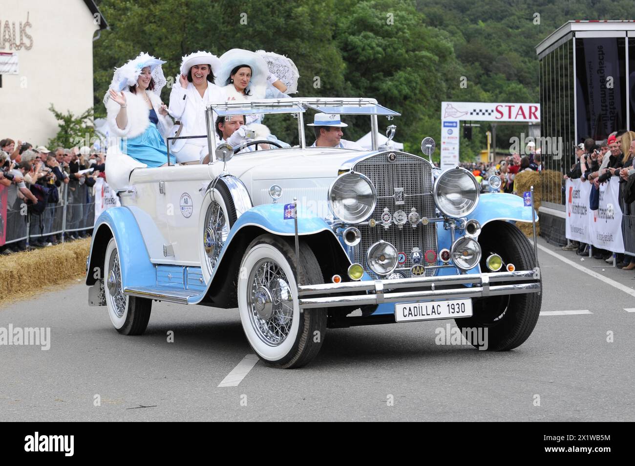 Cadillac Imperial Phaeton, built in 1930, A white Cadillac convertible with costumed woman drives past cheering spectators, SOLITUDE REVIVAL 2011 Stock Photo