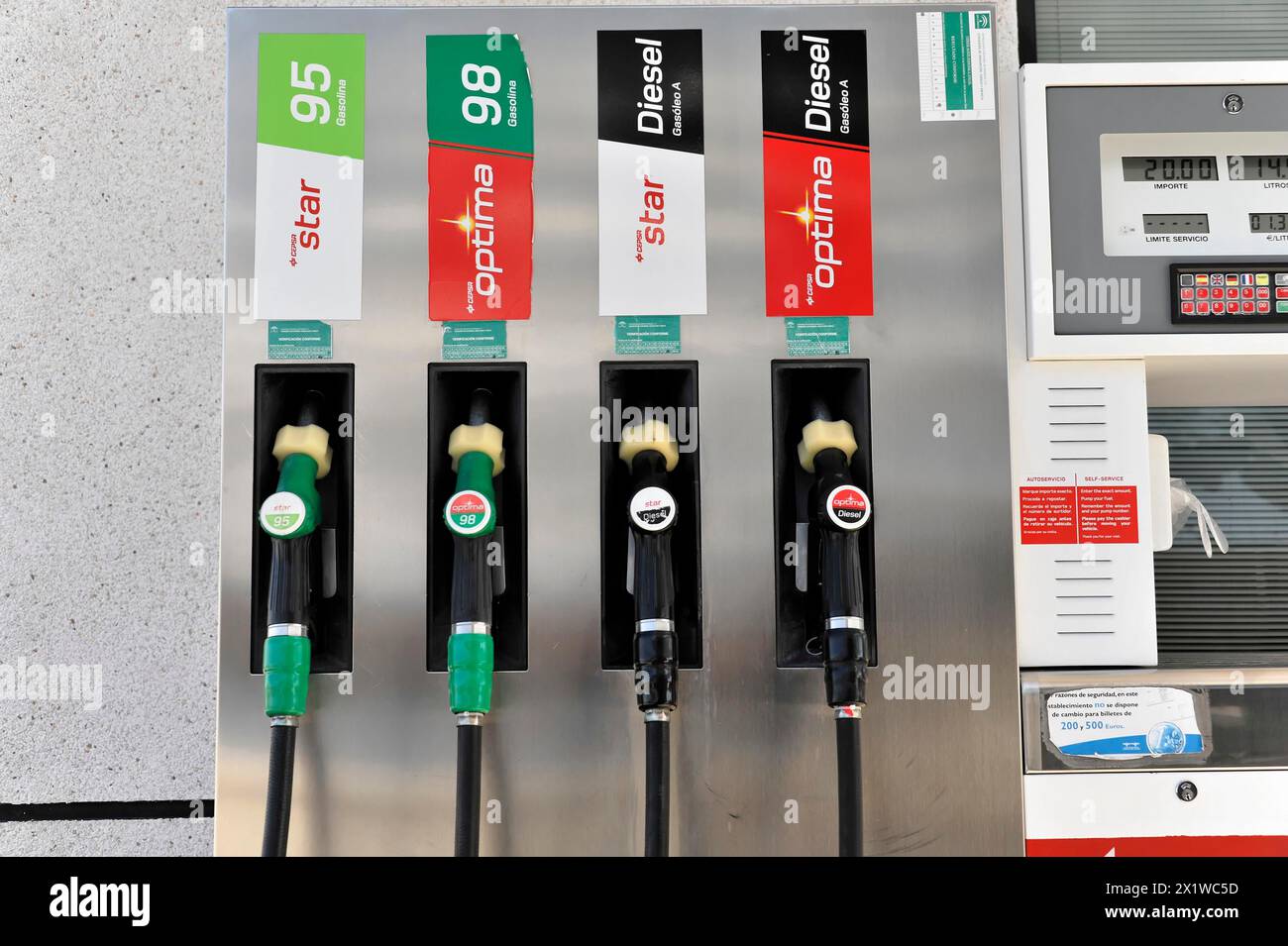 Gueejar-Sierra, Sierra Nevada National Park, fuel pumps at a petrol station with labels and prices for various fuels, Costa del Sol, Andalusia, Spain Stock Photo